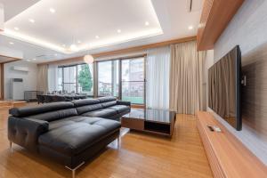 Μια τηλεόραση ή/και κέντρο ψυχαγωγίας στο AOI Sauna SPA & Dog Villa HAKODATE - Vacation STAY 16937