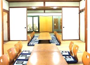 a conference room with wooden tables and chairs at Mihamakan, Izu Oshima - Vacation STAY 89847v in Oshima