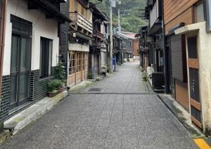 an empty street in an alley with buildings at Mihamakan, Izu Oshima - Vacation STAY 89849v in Oshima