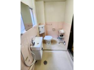 a bathroom with a toilet and a sink at Mamada Building - Vacation STAY 18001 in Tokyo +4 photos