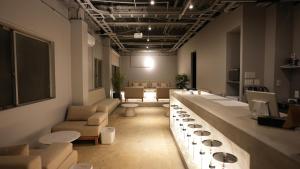 a room with couches and tables in a room at Guesthouse s,e,n - Vacation STAY 99404v in Koriyama +1 photo