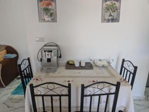 a table with a coffee maker on top of it at Guesthouse Skhirat in Skhirat