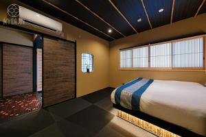 Ένα ή περισσότερα κρεβάτια σε δωμάτιο στο Kyoran - Ryugetsutei - Vacation STAY 12292v +36 φωτογραφίες