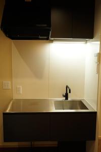 a kitchen counter with a sink and a light at Villa East West - Vacation STAY 18083v in Nara