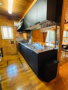 a kitchen with a sink and a counter top at KOZUKA House - Vacation STAY 17813v in Kamogawa