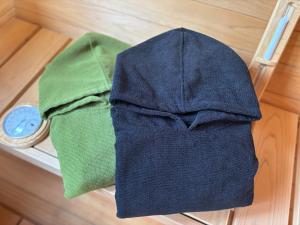 a pile of clothes on a table with a clock at Mori de Waoke Nasuppo - Vacation STAY 23947v in Nasu-yumoto +59 photos