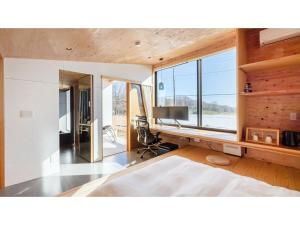 a bedroom with a desk with a computer and a window at Mori de Waoke Nasuppo - Vacation STAY 23947v in Nasu-yumoto