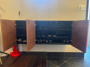 a room with a shelf with pots and pans at Ryokan YaDOKARI - Vacation STAY 28940v in Toyooka