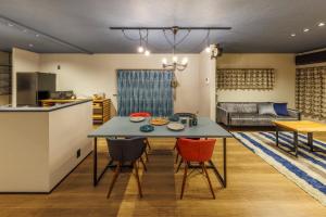 a kitchen and living room with a table and chairs at villa-rizo midorigaoka - Vacation STAY 17519 in Takayama