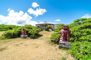 two red fire hydrants in front of a house at Kumi No Yado Gettou - Vacation STAY 31704v in Kadekaru