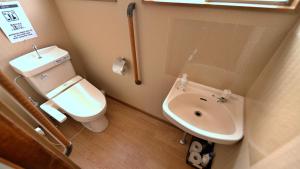 a small bathroom with a toilet and a sink at Waka no Yado -Oto- - Vacation STAY 17181 in Wakayama +20 photos