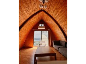 a living room with a large window and a couch at ARCH HOUSE TAKASHIMA - Vacation STAY 31925v in Takashima +15 photos