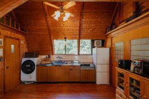 a kitchen with a sink and a refrigerator at ARCH HOUSE TAKASHIMA - Vacation STAY 31925v in Takashima