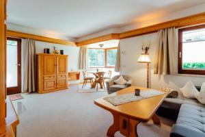 a living room with a couch and a table at Haus ANNELIES Top 3 by Moni-care in Seefeld in Tirol