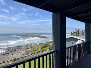 a view of the ocean from a house balcony at Mazeppa Sunrise Beach Accommodation in Mazeppa Bay