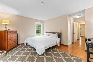 a bedroom with a bed and a dresser and a desk at New!! Pool Vibes At Vanishing Run in Harwood