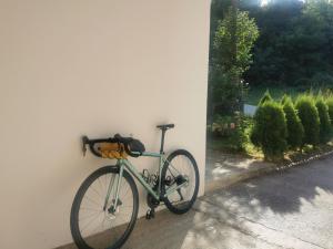 a bike parked against a wall next to a window at Novi Apartman 19 in Foča