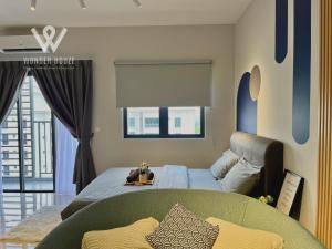 a bedroom with a bed and a couch at Modern Stay at Seri Kembangan - 20 mins to Pavilion Bukit Jalil in Seri Kembangan +126 photos