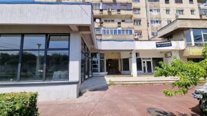 an empty building with a building in the background at MMT SweetHome Sud in Ploieşti