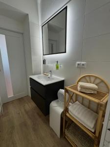 a bathroom with a sink and a mirror at Apartmán U Bedříška in Litomyšl