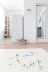 a white table with cards on top of it at Family House GO TO - Parking & Dog Yard in Kavarna