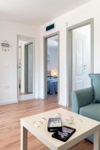 a living room with a table and a couch at Family House GO TO - Parking & Dog Yard in Kavarna