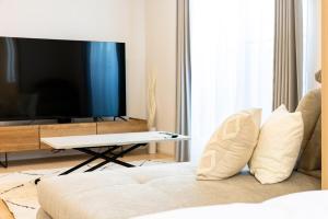 TV a/nebo společenská místnost v ubytování AMP FLAT Yoshizuka
