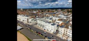 an aerial view of a city with buildings and a street at House by the Sea, Worthing in Worthing