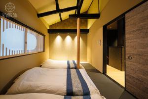 Un pat sau paturi într-o cameră la KYORAN-GETKOTEI - Vacation STAY 56959v
