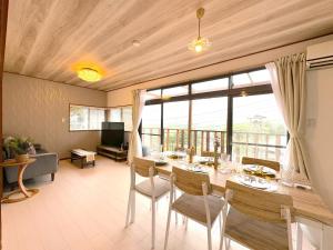 a dining room with a table and a large window at Ashigarashimogun - House - Vacation STAY 17328 in Miyakami