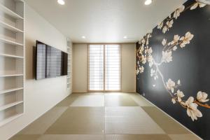 a hallway with a flower mural on the wall at Oyado michi - Vacation STAY 55924v in Sasebo