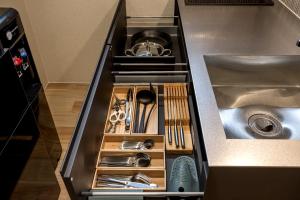 a drawer in a kitchen with silver utensils at Oyado michi - Vacation STAY 55924v in Sasebo