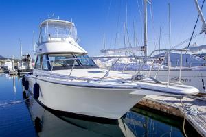 a white boat docked at a dock in the water at Oyado michi - Vacation STAY 47702v in Sasebo