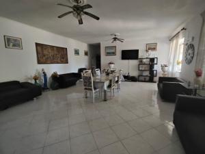 a large living room with a table and chairs at Alloggio per uso turistico Aldo Lo Presti in Campo di Carne +32 photos