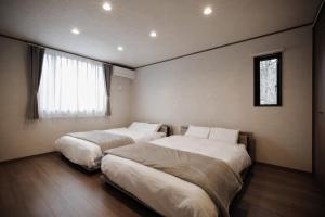 Postel nebo postele na pokoji v ubytování ZAO PEAK - Zao Sansuien Gaia Resort - Vacation STAY 54046v