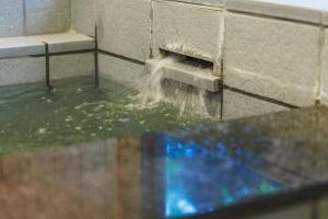 a water fountain in a wall in a bathroom at Zao Villa Suite Zen-ZEN - Vacation STAY 74899v in To-katta