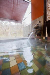 a bathroom with a pool of water with a fountain at ZAO Hotaru no niwa - Vacation STAY 54095v in To-katta
