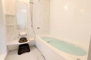Ένα μπάνιο στο Rental villa with open-air hot spring bath "Rioren - Vacation STAY 54190v +15 φωτογραφίες