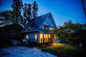 a house at night with its lights on at Private cottage with wood stove [Senichi no Yado] - Vacation STAY 54169v in To-katta