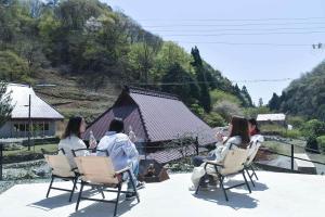 a group of people sitting in chairs on a patio at glaminka SAYO - Handi - Vacation STAY 85065v in Sayo