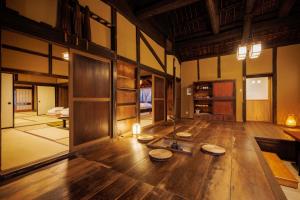 a large room with wooden floors and wooden walls at Muratamachi bukeyashiki- Gaia Resort - Vacation STAY 54893v in Murata