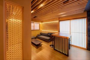 a living room with a couch and a table at KYORAN-FUKITEI - Vacation STAY 57002v in Kyoto