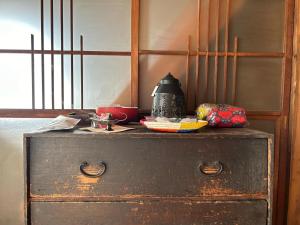an old dresser with a lamp on top of it at Tonegun - House - Vacation STAY 17719 in Kawaba +5 photos