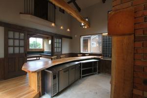 a large kitchen with wooden cabinets and a counter top at Kitakaruizawa Sweet Grass - Vacation STAY 61669v in Kita-karuizawa