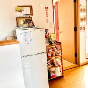 a white refrigerator in a kitchen with food at Makeit 1to3 - Vacation STAY 17354 in Chichibu +4 photos