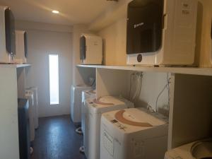 a room with boxes and appliances in a room at HARMONY HOTEL Urawa - Vacation STAY 18310 in Saitama +14 photos