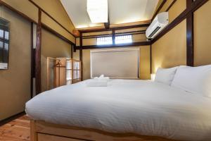 Ένα ή περισσότερα κρεβάτια σε δωμάτιο στο Kyoto City - House - Vacation STAY 17378