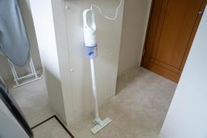 a white inhaler in a corner of a room at Flex cella satozuka - Vacation STAY 17763 in Sapporo +93 photos