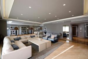 a large living room with a couch and a table at Luxurious Penthouse in Marbella