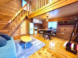 a living room with a bed and a dining room at Makino MeguRia - Vacation STAY 32791v in Takashima